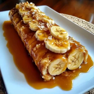 Delicious banana caramel roulade dessert, topped with caramel and sliced bananas.