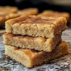 Chewy snickerdoodle cookie bars with cinnamon sugar topping