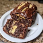 Delicious chocolate marbled banana bread on a rustic wooden table.