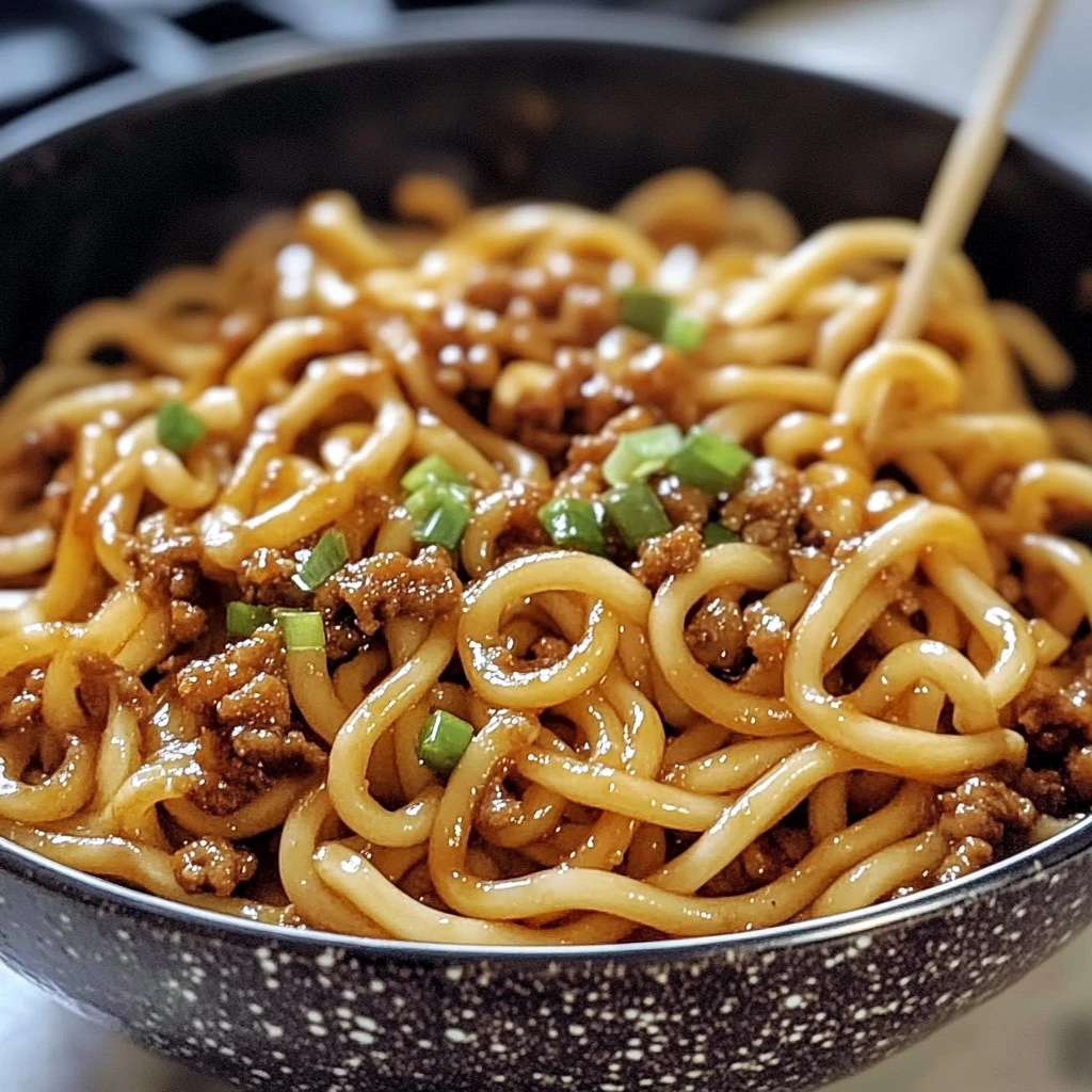 Delicious plate of Mongolian Noodles garnished with vegetables