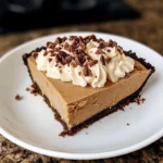 No-bake peanut butter pie with a graham cracker crust and chocolate drizzle