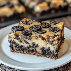 Delicious Oreo Magic Cookie Bars on a plate, ready to enjoy.