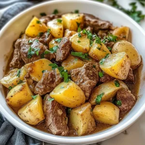 Slow Cooker Loaded Steak and Potatoes dish garnished and ready to serve.
