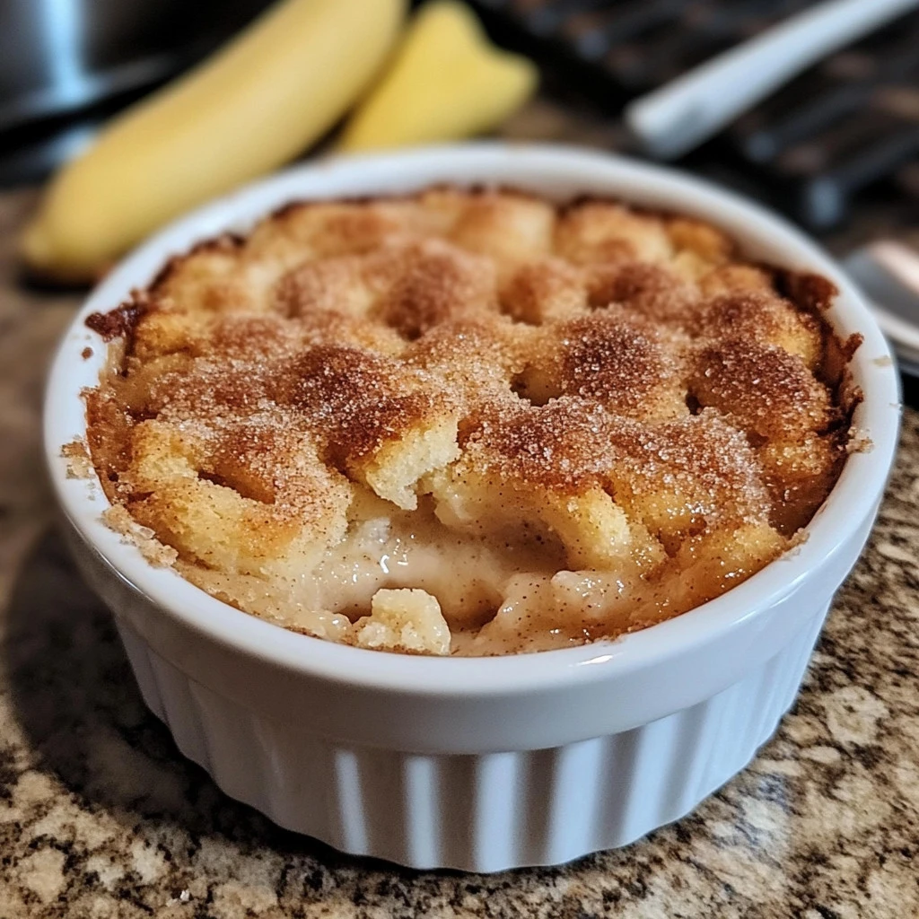 Delicious snickerdoodle cobbler served with a scoop of vanilla ice cream