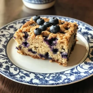Homemade Blueberry Coffee Cake with fresh blueberries on a plate
