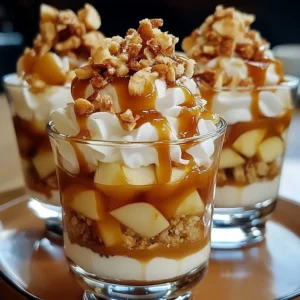 Layered caramel apple trifles with whipped cream and caramel drizzle