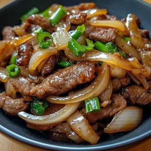 Delicious Chinese beef and onion stir fry ready to serve