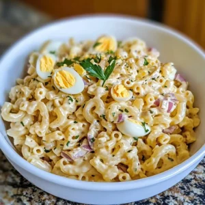 Delicious Deviled Egg Pasta Salad with Macaroni in a serving bowl
