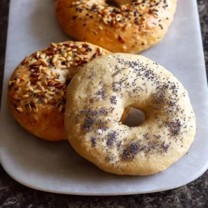 Freshly baked gluten-free vegan bagels, golden brown and delicious.
