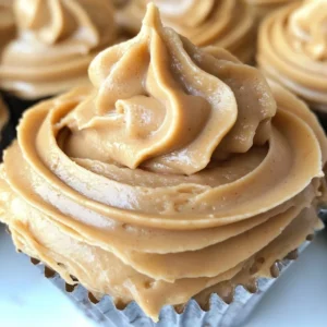 Delicious creamy peanut butter frosting spread on cupcakes