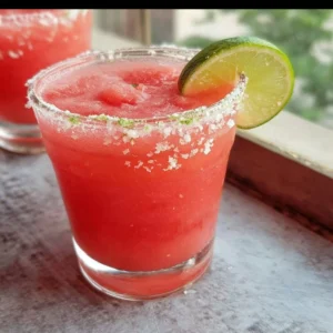 Refreshing Watermelon Margarita served in a chilled glass with lime slices
