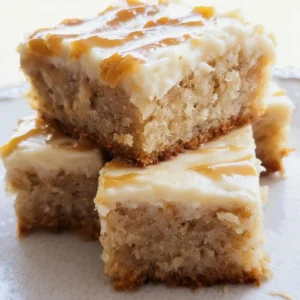 Delicious banana bars with salted caramel frosting on a wooden table