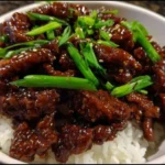 Bowl of easy crispy Mongolian beef with vegetables and rice
