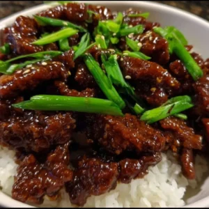 Bowl of easy crispy Mongolian beef with vegetables and rice