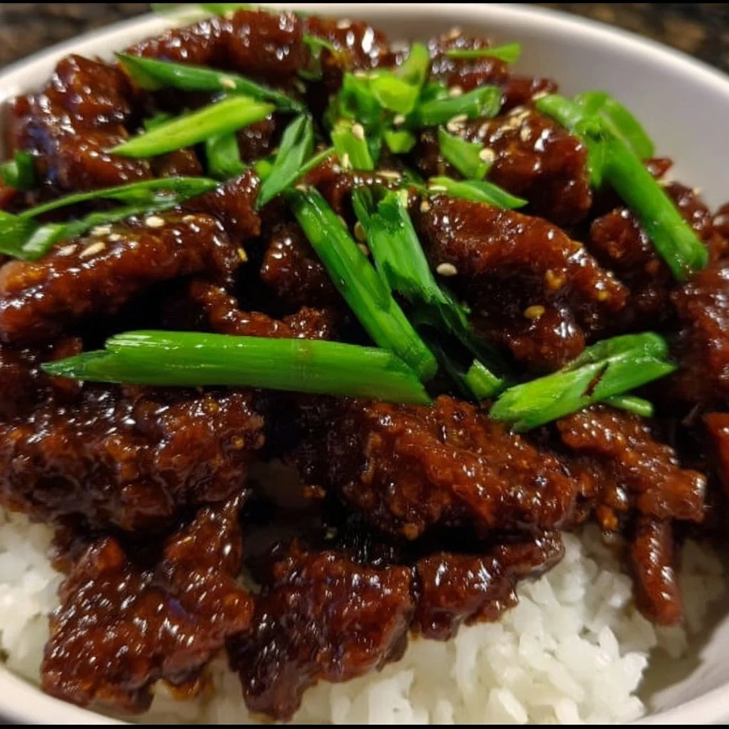 Bowl of easy crispy Mongolian beef with vegetables and rice