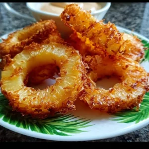 Delicious fried pineapple rings served on a plate