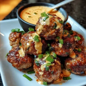 Korean BBQ Meatballs served with a spicy mayo dip on a plate