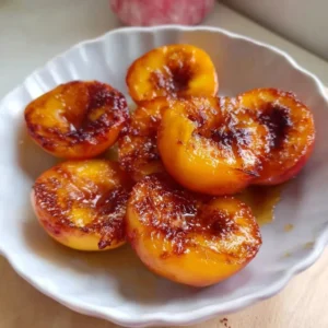 Delicious air fryer peaches topped with honey and cinnamon