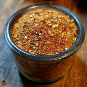 Homemade Slap Ya Mama Seasoning mix in a bowl with spices