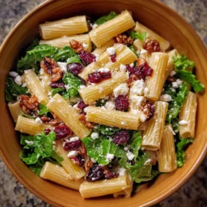 Feta and cranberry rigatoni salad with lemon vinaigrette served in a bowl