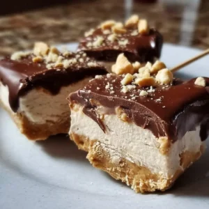 Frozen peanut butter yogurt bars topped with a drizzle of chocolate