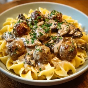 One Pan Meatball Stroganoff served in a skillet with a creamy sauce