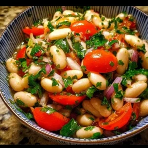 Delicious Piyaz, a traditional Turkish white bean salad garnished with vegetables.