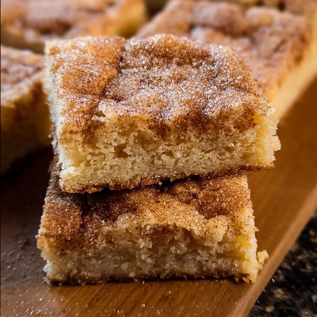 Delicious homemade snickerdoodle bars topped with a cinnamon sugar mixture.