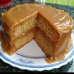 Delicious butterscotch cake with caramel icing on a plate