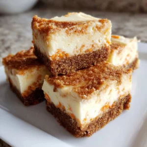 Delicious carrot cake cheesecake bars with cream cheese frosting and walnuts