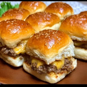 Cheeseburger sliders made with Hawaiian rolls served on a platter