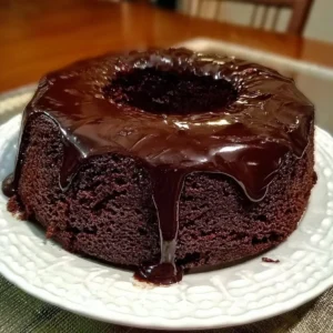 Decadent chocolate brownie cake topped with chocolate ganache.