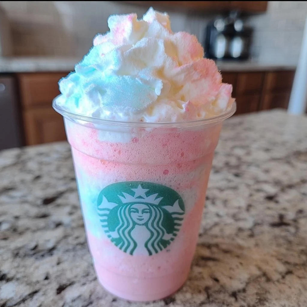 Delicious Cotton Candy Cloud Frappuccino topped with whipped cream and colorful sprinkles