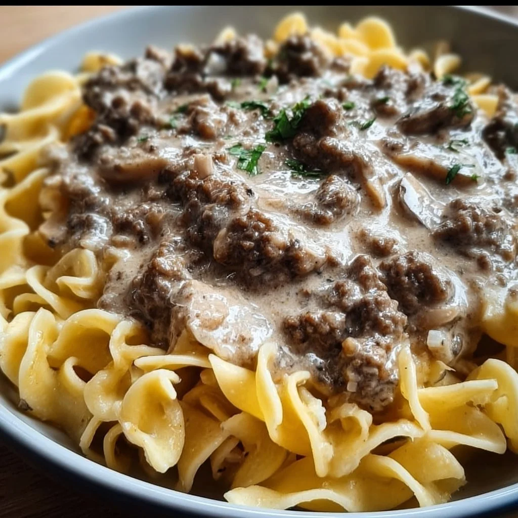Bowl of creamy ground beef stroganoff with noodles and mushrooms