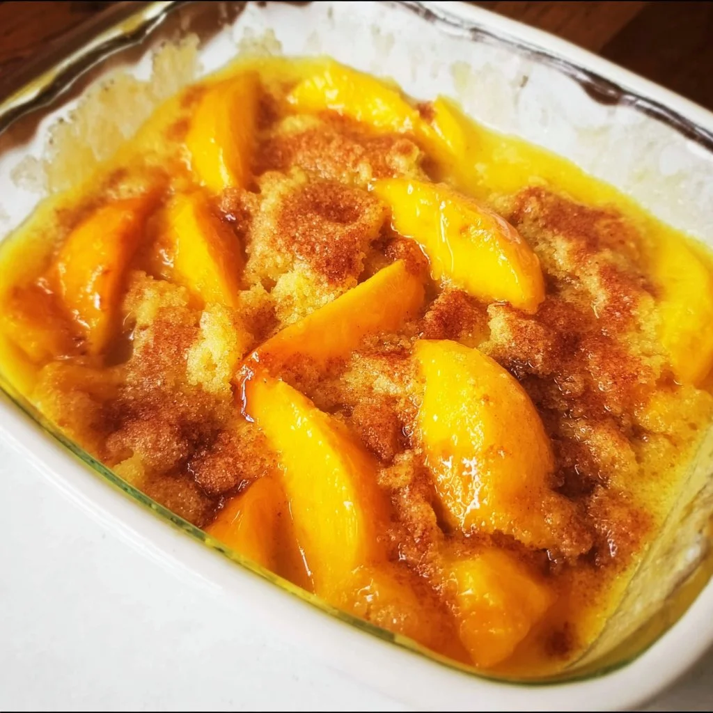 Fresh peach cobbler with juicy peaches baked to perfection