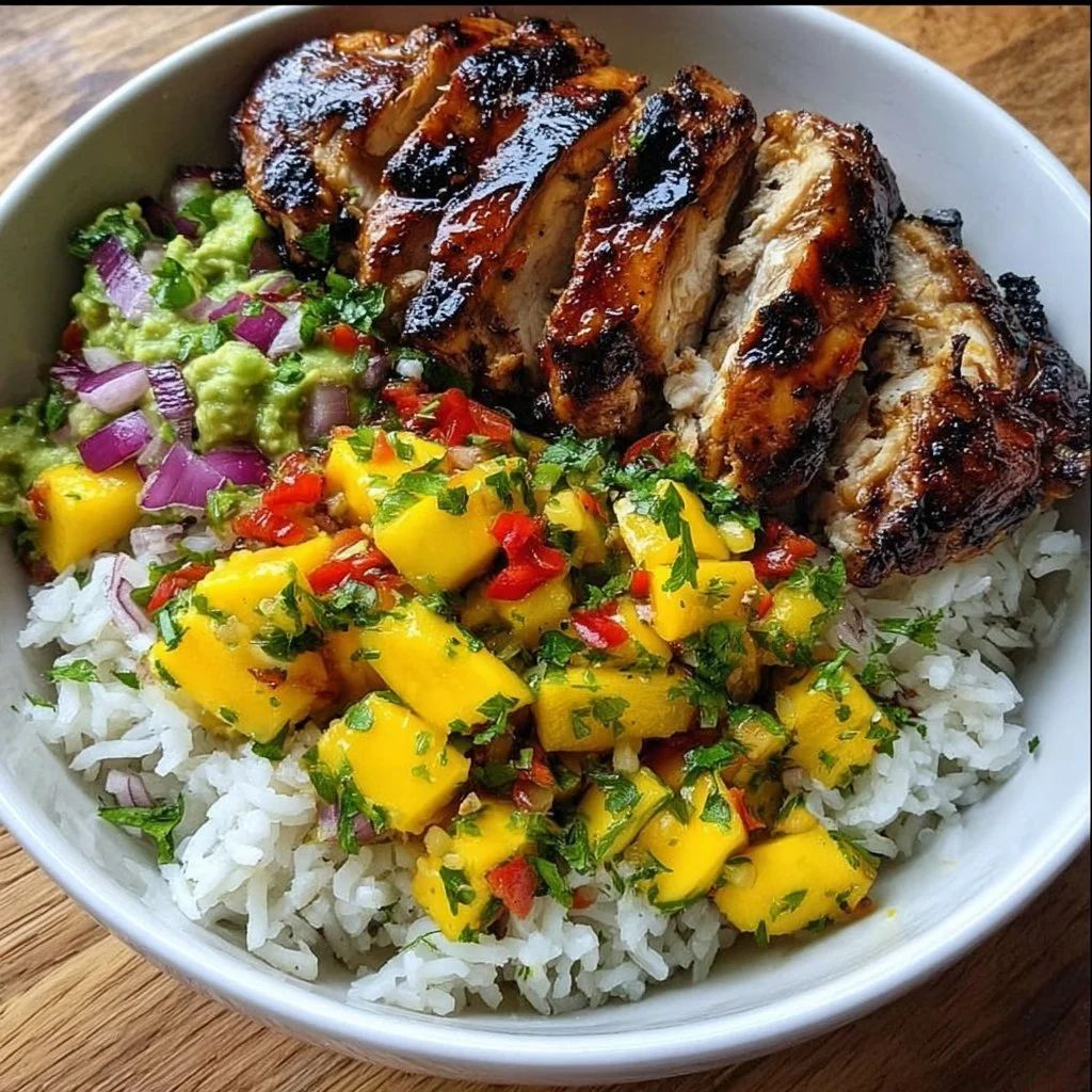 Delicious jerk chicken bowl with mango salsa and coconut rice