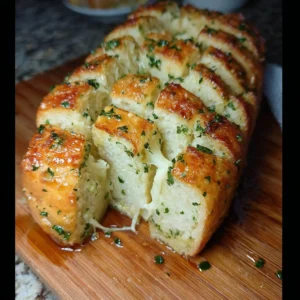 Delicious pull apart garlic bread, golden brown and fluffy, ready to be enjoyed.