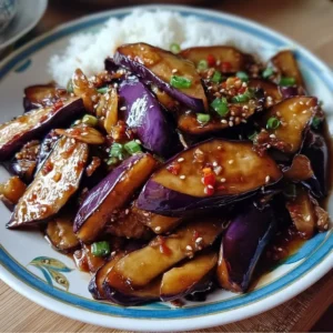 Sautéed Chinese eggplant in garlic sauce served in a bowl