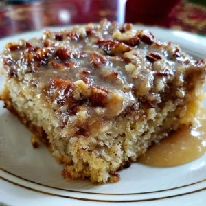 Slice of Southern Pecan Praline Sheet Cake with rich praline topping