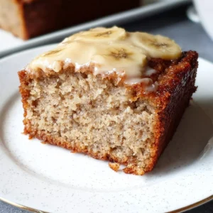 Deliciously moist homemade banana cake topped with frosting