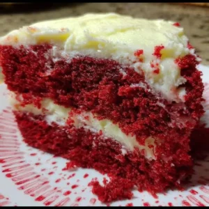 Delicious slice of the best Red Velvet Cake with cream cheese frosting