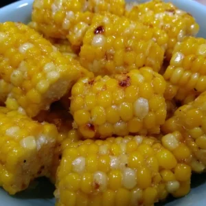 Bowl of crispy and delicious fried corn served as a tasty side dish.