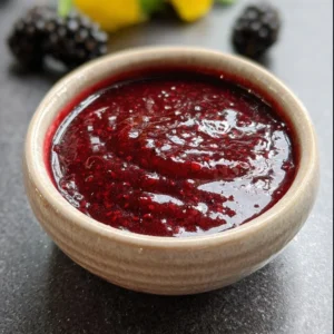 Delicious homemade blackberry dessert sauce in a glass jar