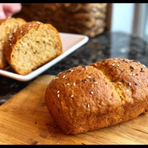 Freshly baked Red Lentil Bread on a wooden table.