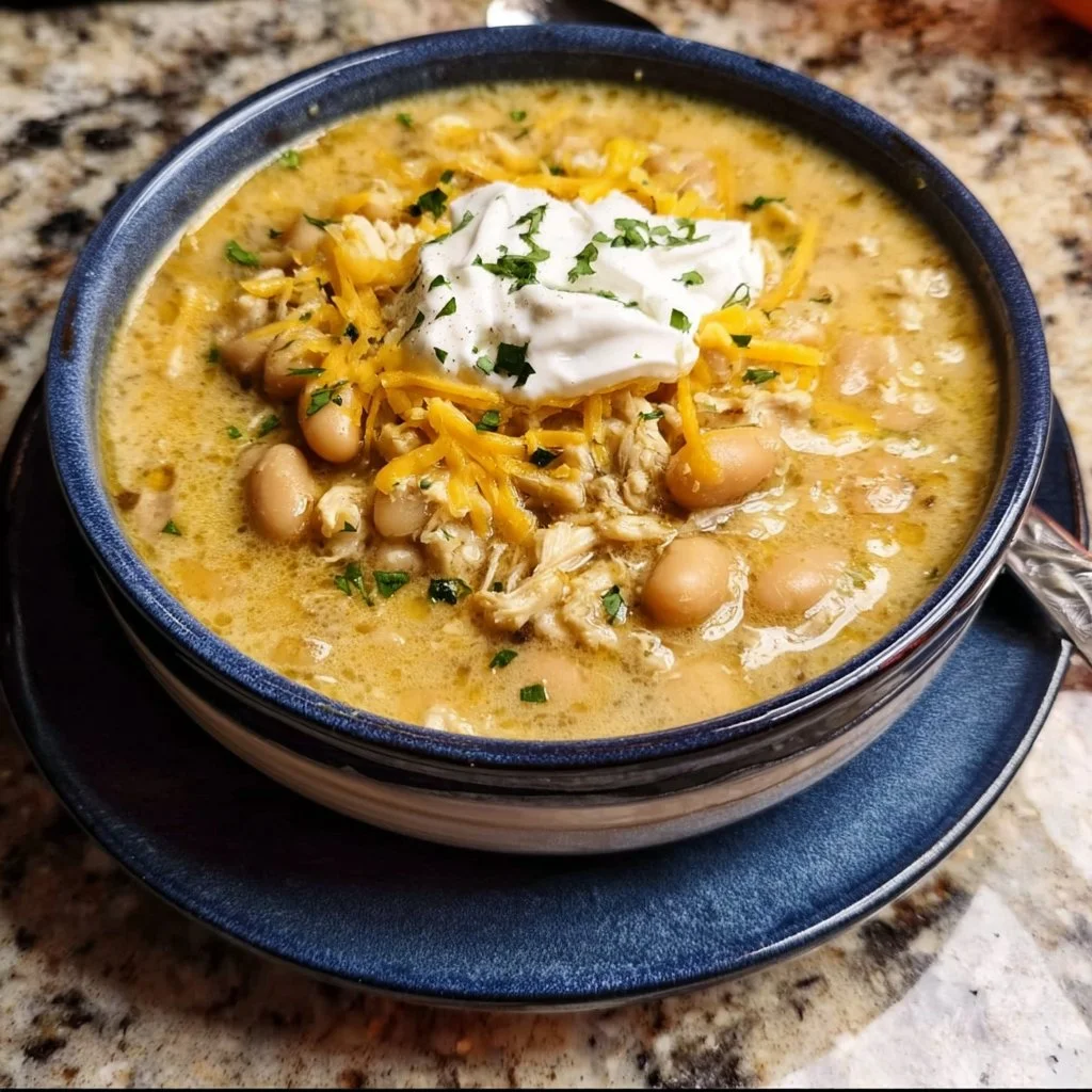 Bowl of white chili with chicken and white beans topped with cilantro