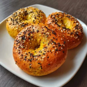 Freshly baked yellow lentil bagel showcasing a vibrant color and unique texture.