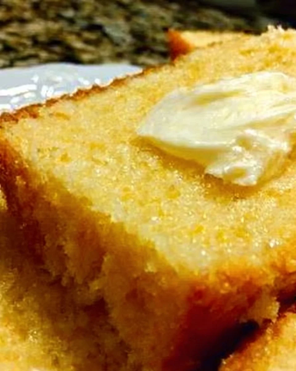 Delicious homemade Amish sour cream cornbread served in a rustic setting.