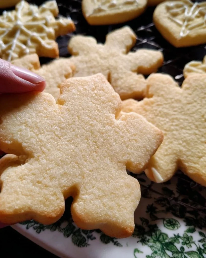 Freshly baked no spread gluten free sugar cookies on a cooling rack
