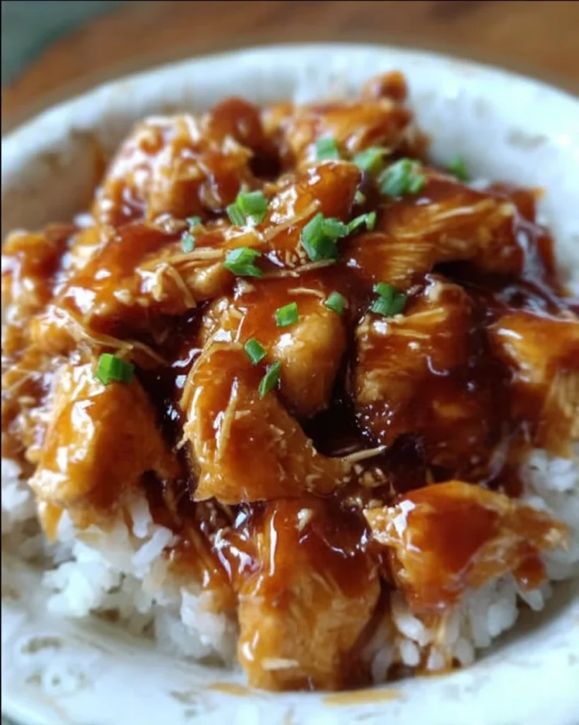 Sweet Hawaiian Crockpot Chicken served with rice and pineapple slices