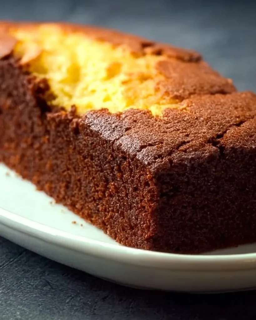Delicious slice of Brownie Butter Cake showcasing rich chocolate layers and buttery texture